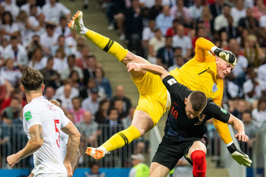 goalkeeper Jordan Pickford of England collides with Ante