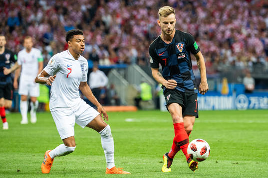 Jesse Lingard of England and Ivan Rakitic of Croatia