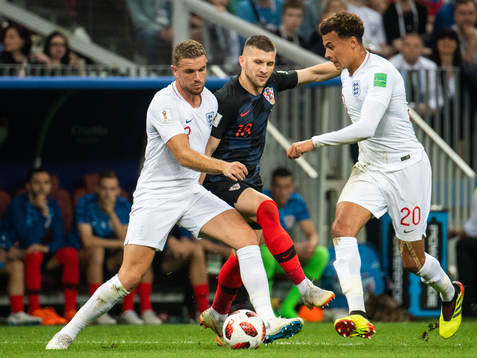 Jordan Henderson and Dele Alli of England competes for the