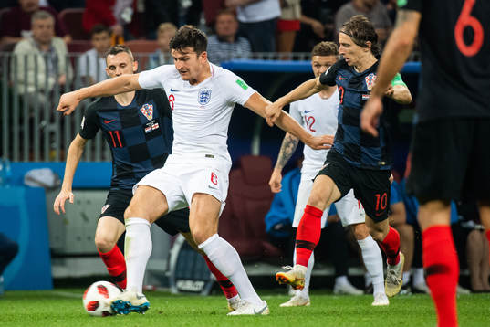 Harry Maguire of England and Marcelo Brozovic of Croatia