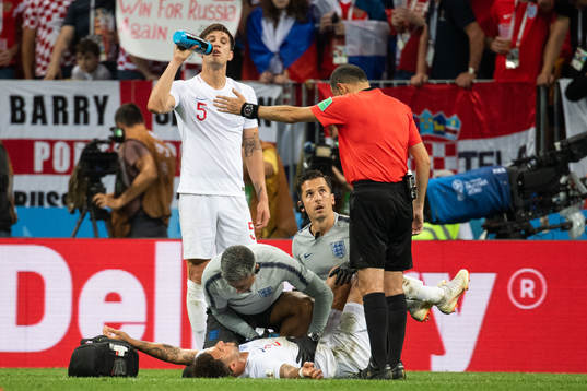 Kyle Walker of England receives medical assistance