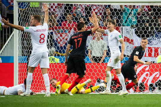 Jordan Henderson, John Stones and Harry Maguire react as