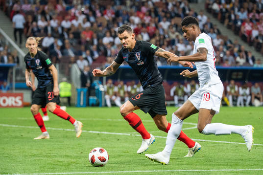 Dejan Lovren of Croatia defends against Marcus Rashford of