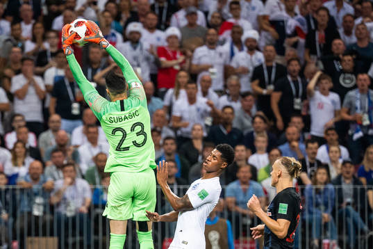 goalkeeper Danijel Subasic of Croatia takes the ball in