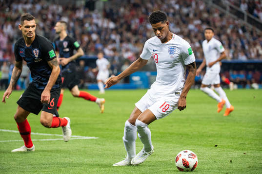Marcus Rashford of England and Dejan Lovren of Croatia
