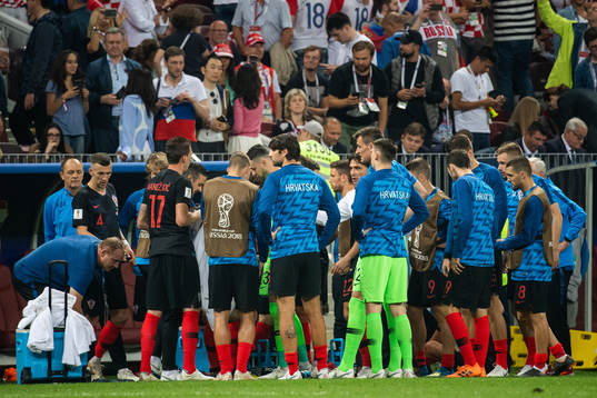 Players of Croatia gather in wait for extra time