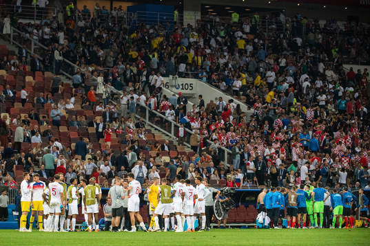 Players of England and of Croatia gather in wait for extra