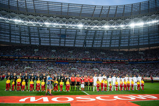 Players of Croatia and of England line up prior to the FIFA