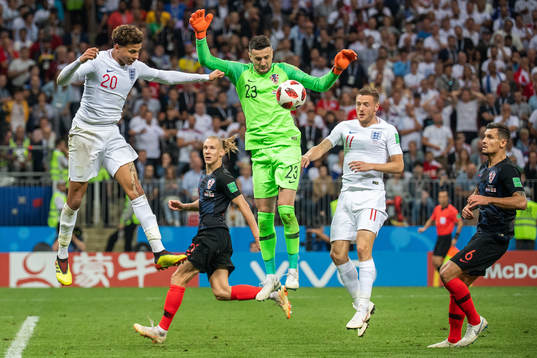 Dele Alli of England and goalkeeper Danijel Subasic of