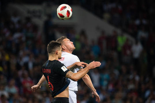 Jamie Vardy of England and Dejan Lovren of Croatia competes