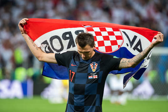 Mario Mandzukic of Croatia celebrate with a flag