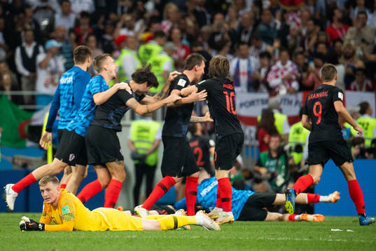 goalkeeper Jordan Pickford of England looks dejected while