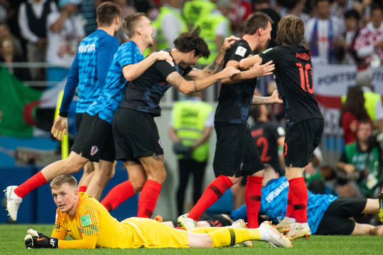 goalkeeper Jordan Pickford of England looks dejected while