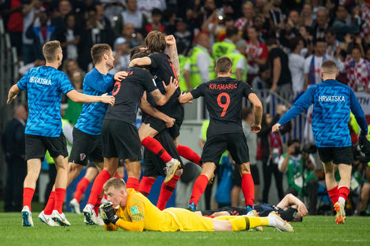 goalkeeper Jordan Pickford of England looks dejected while