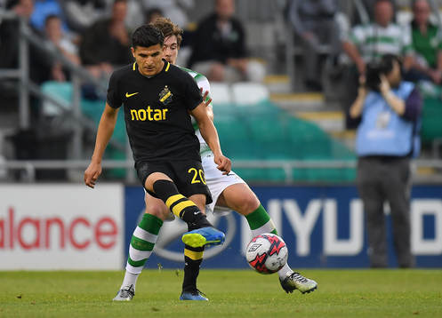 Tarik Elyounoussi of AIK in action against Sam Bone of