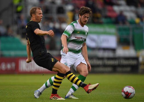 Per Karlsson of AIK in action against Sam Bone of Shamrock