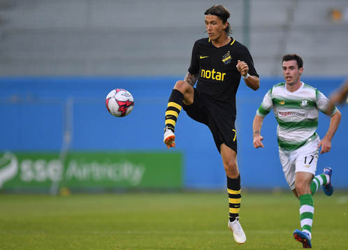 Kristoffer Olsson of AIK in action against Joel Coustrain