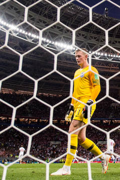 Goalkeeper Jordan Pickford of England looks dejected