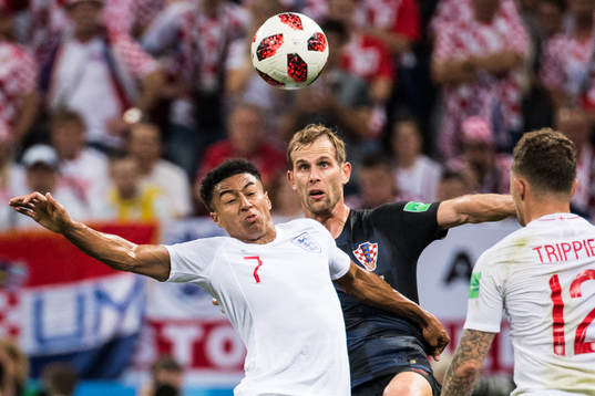 Jesse Lingard of England and Ivan Strinic of Croatia