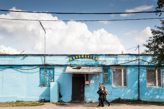 People are seen walking the street