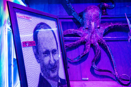 A picture of Russia President Vladimir Putin beside a