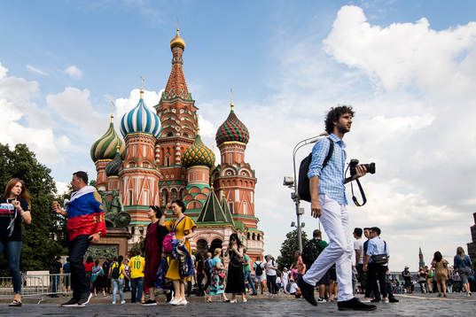 People har walking in front of The Saint Basil's Cathedral