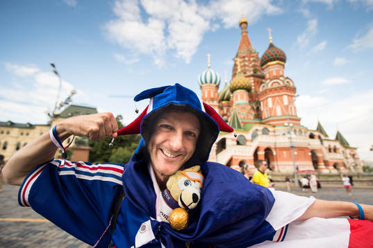 A fan of France in front of Saint Basil's Cathedral at the