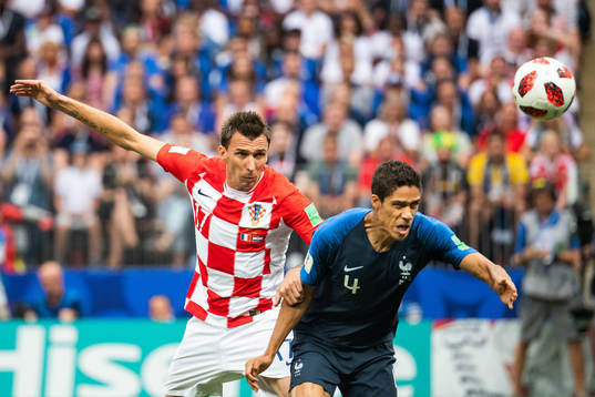 Mario Mandzukic of Croatia and Raphael Varane of France