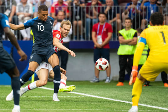 Ivan Strinic of Croatia and Kylian Mbappe of France 1cb<