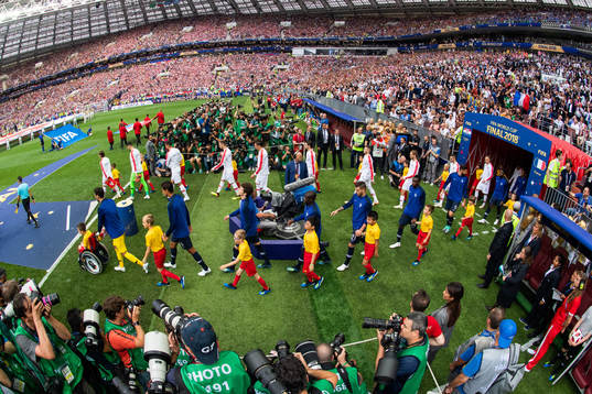 Players of France and of Croatia enter the pitch prior to