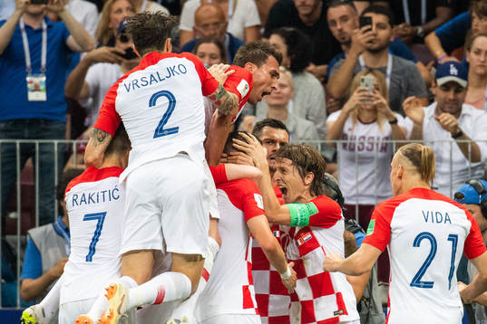 Luka Modric and Ivan Perisic celebrates with team mates