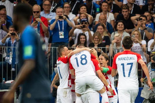 Luka Modric and Ivan Perisic celebrates with team mates