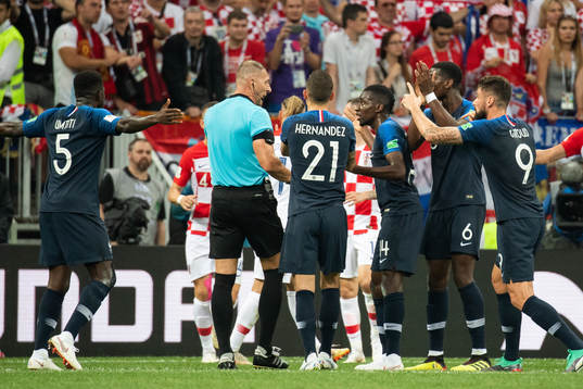 Players of France reacts and calls for a penalty against