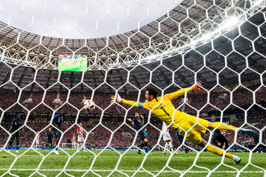 Ivan Perisic of Croatia scores the 1-1 goal behind