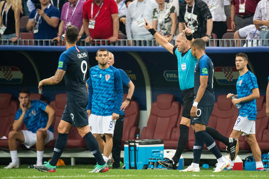 Referee Nestor Pitana signals for video review regarding a