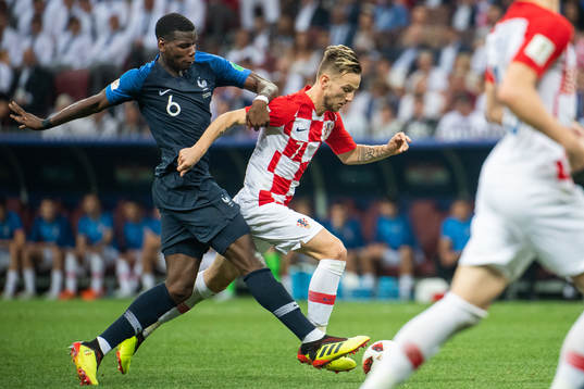 Paul Pogba of France and Ivan Rakitic of Croatia competes