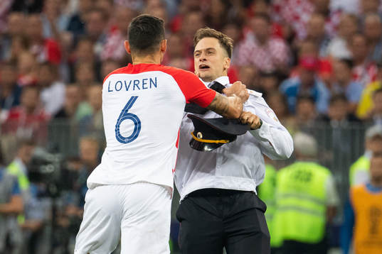 Dejan Lovren of Croatia in a situation with a man who has