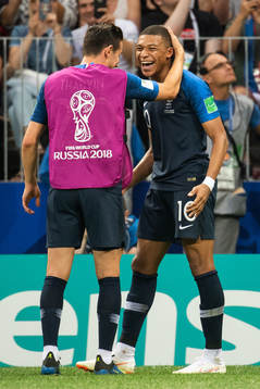 Kylian Mbappe of France celebrates with team mates