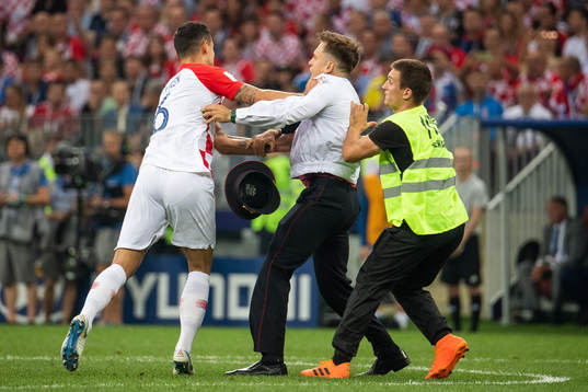 Dejan Lovren of Croatia and steward in a situation with a