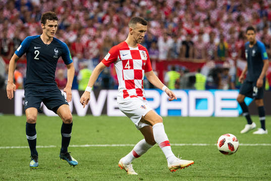 Benjamin Pavard of France and Ivan Perisic of Croatia