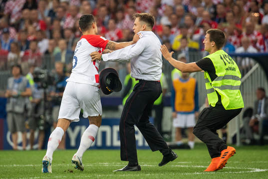 Dejan Lovren of Croatia and a stewards in a situation with