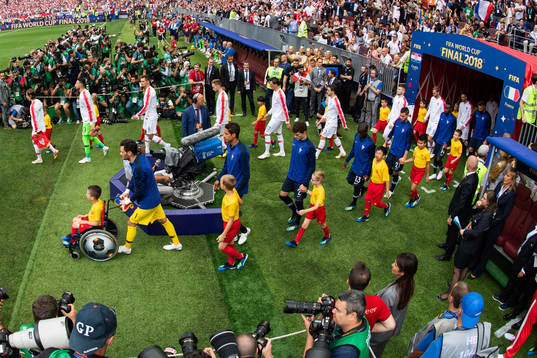 Players of France and of Croatia enter the pitch prior to