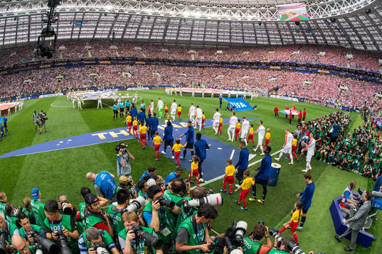 Players of France and of Croatia enter the pitch prior to