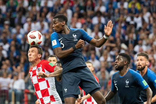Mario Mandzukic of Croatia and Paul Pogba of France