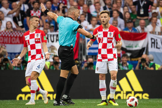 Ivan Rakitic of Croatia reacts against the referee Nestor