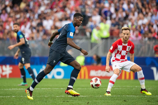 Paul Pogba of France and Ivan Rakitic of Croatia