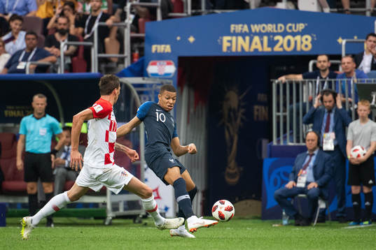 Kylian Mbappe of France and Mario Mandzukic of Croatia