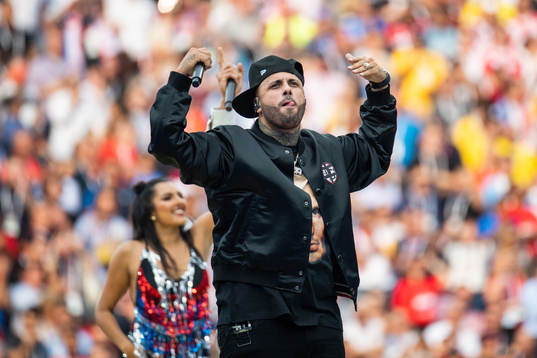 An artist singing at the closing ceremony prior to the FIFA