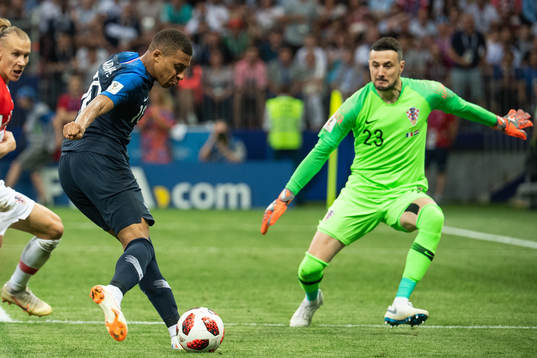 Kylian Mbappe of France and goalkeeper Danijel Subasic of