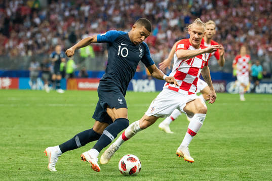 Kylian Mbappe of France and Domagoj Vida of Croatia